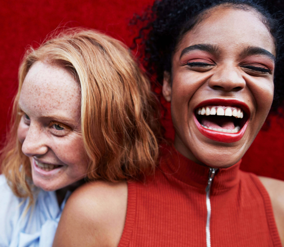 Two youthful friends laughing and having a great time